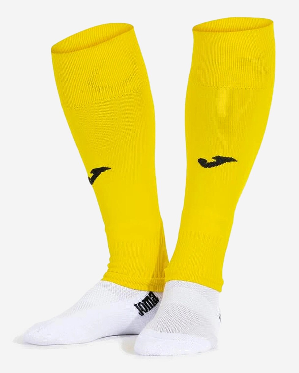 Umas meias pelo joelho que se caracterizam por não terem pé, e que incluem uma tira de elástico para te...  MEIAS JOMA LEG II CALF SIN PIE - AMARELO