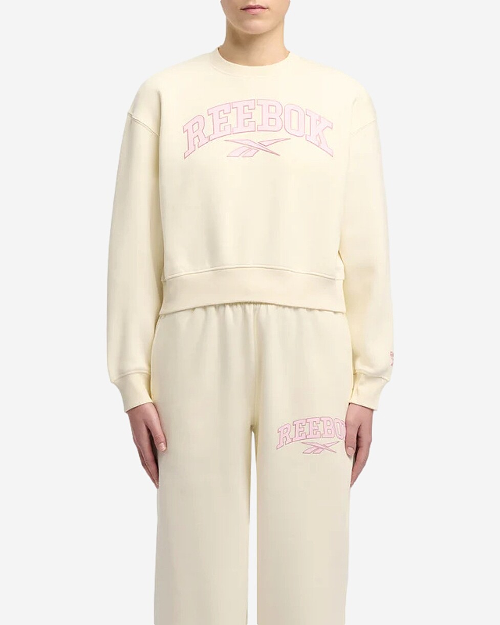 Para o teu dia a dia, a sweat VARSITY da Reebok, é uma peça essencial. Feita com um tecido de mistura de...  SWEAT REEBOK PEARL VARSITY - BEGE