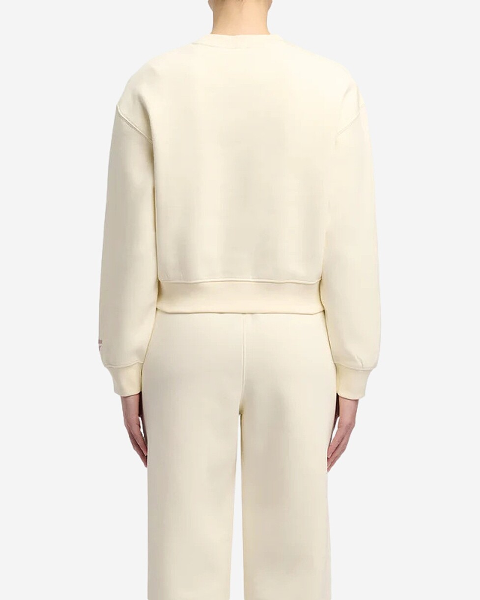 Para o teu dia a dia, a sweat VARSITY da Reebok, é uma peça essencial. Feita com um tecido de mistura de...  SWEAT REEBOK PEARL VARSITY - BEGE